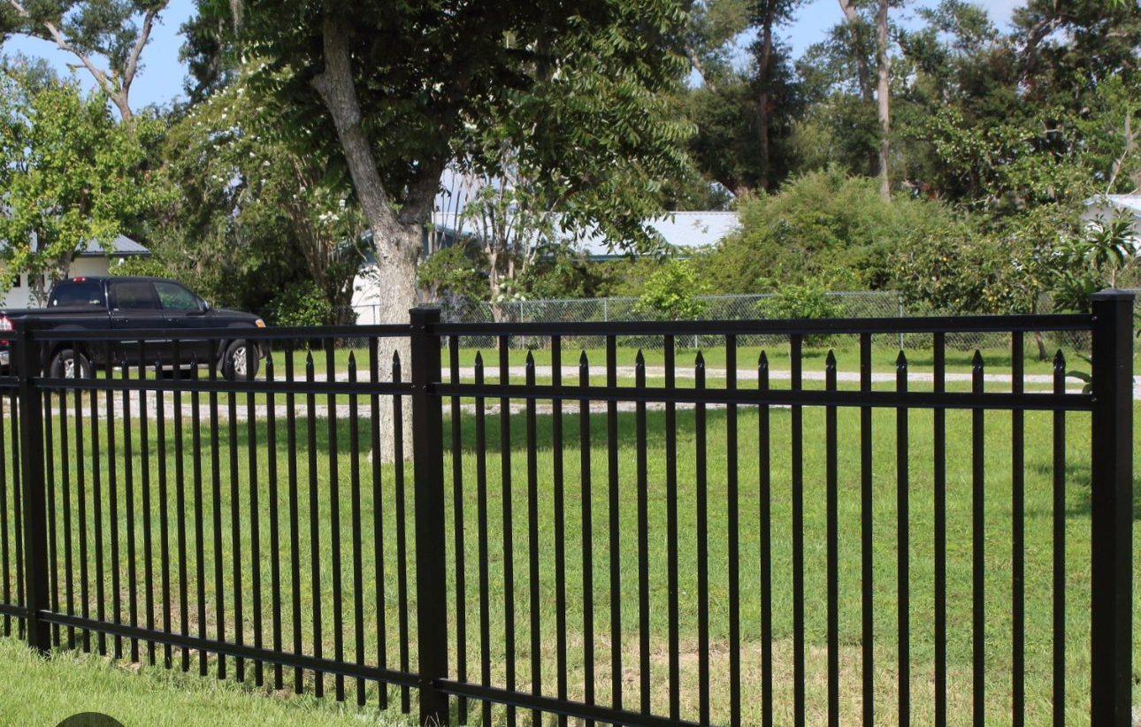 Black metal residential fence installation